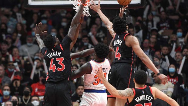 Dec 10, 2021; Toronto, Ontario, CAN; New York Knicks forward Julius Randle (30) has a shot blocked by a group of Toronto Raptors players in the second half at Scotiabank Arena. Mandatory Credit: Dan Hamilton-USA TODAY Sports